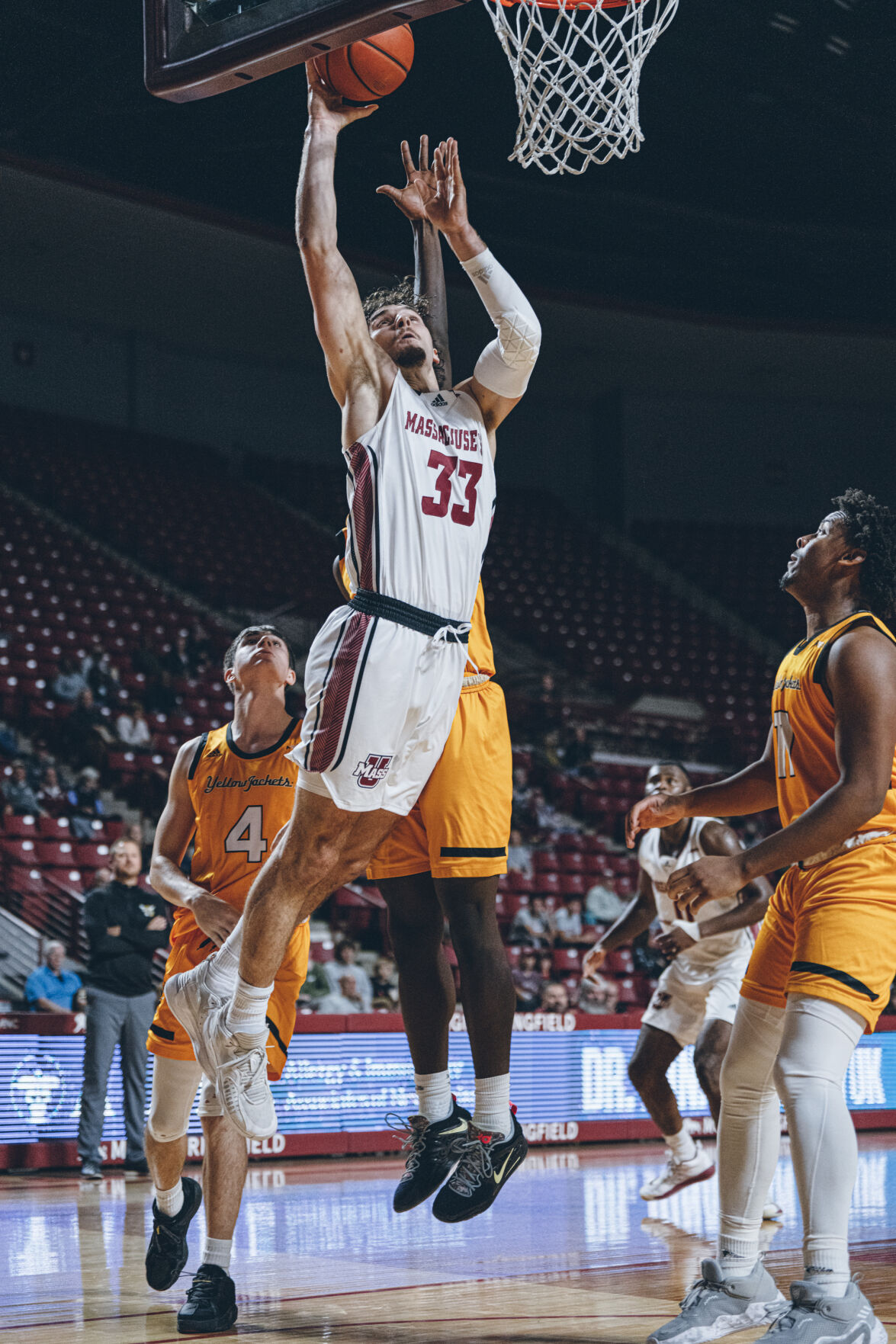 basketball player shoots layup